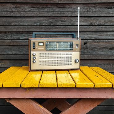 Old radio on yellow table